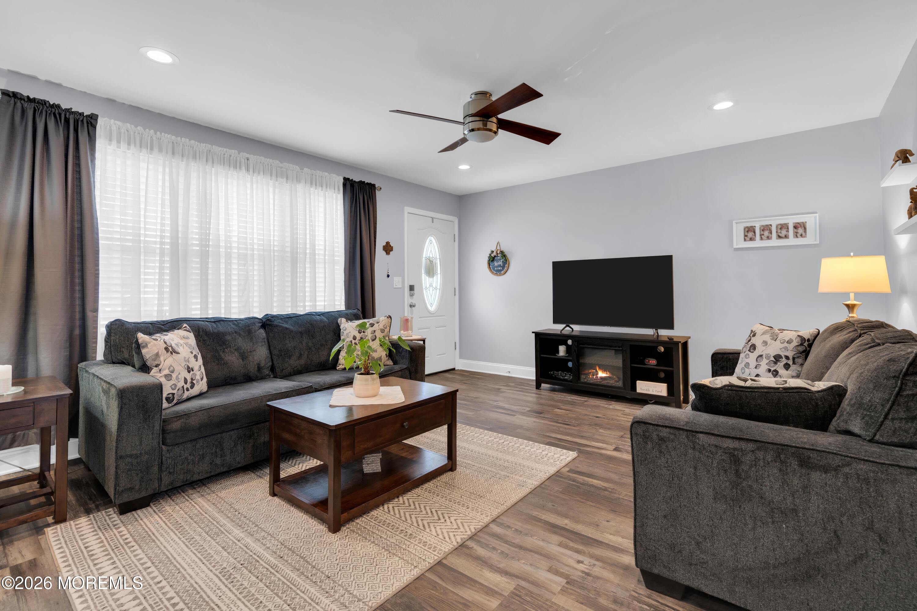 1335 Sunrise Avenue Point Pleasant, NJ 08742 - Photo 17 of 51 a living room with furniture and a flat screen tv