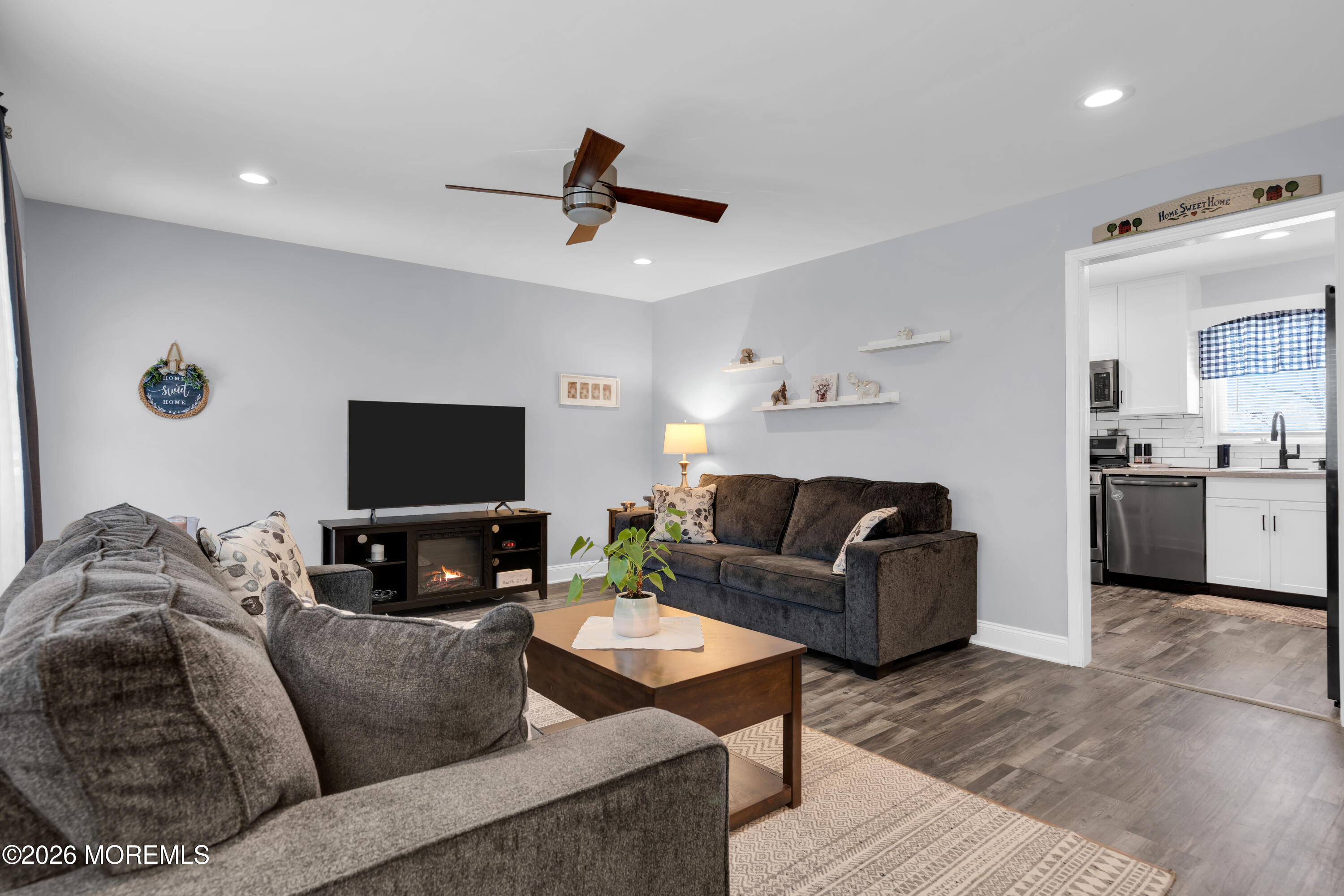 1335 Sunrise Avenue Point Pleasant, NJ 08742 - Photo 18 of 51 a living room with furniture and a flat screen tv