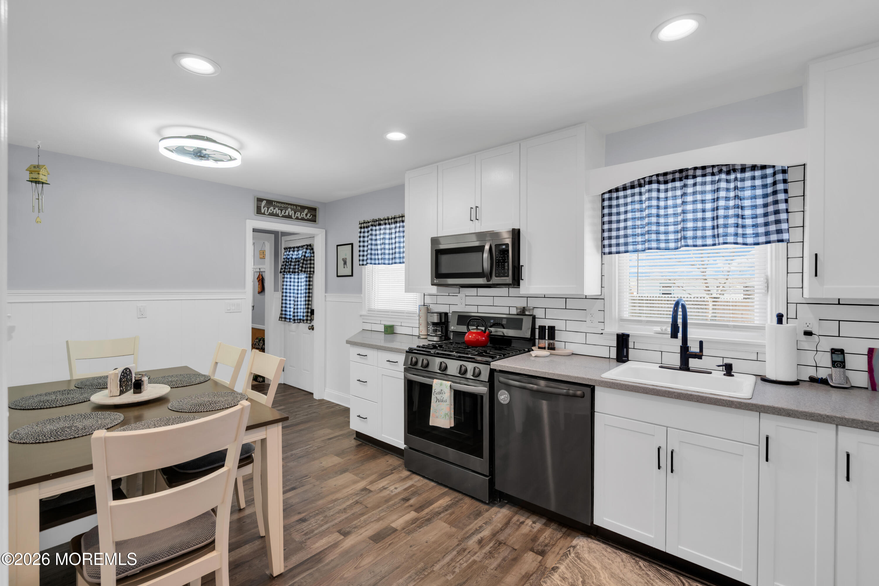 1335 Sunrise Avenue Point Pleasant, NJ 08742 - Photo 22 of 51 a kitchen with stainless steel appliances a stove sink cabinets and wooden floor