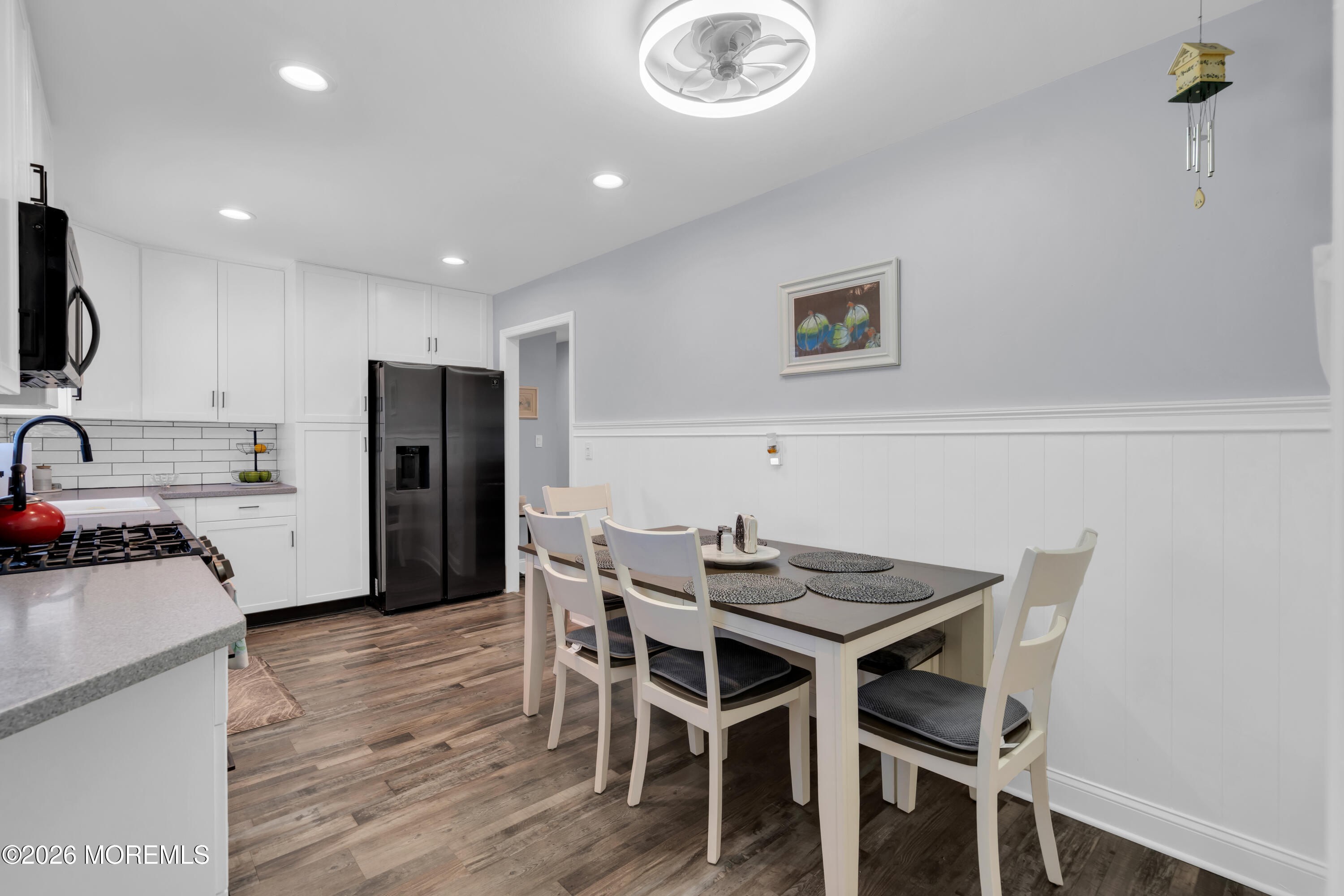 1335 Sunrise Avenue Point Pleasant, NJ 08742 - Photo 25 of 51 a view of a dining room with furniture and wooden floor