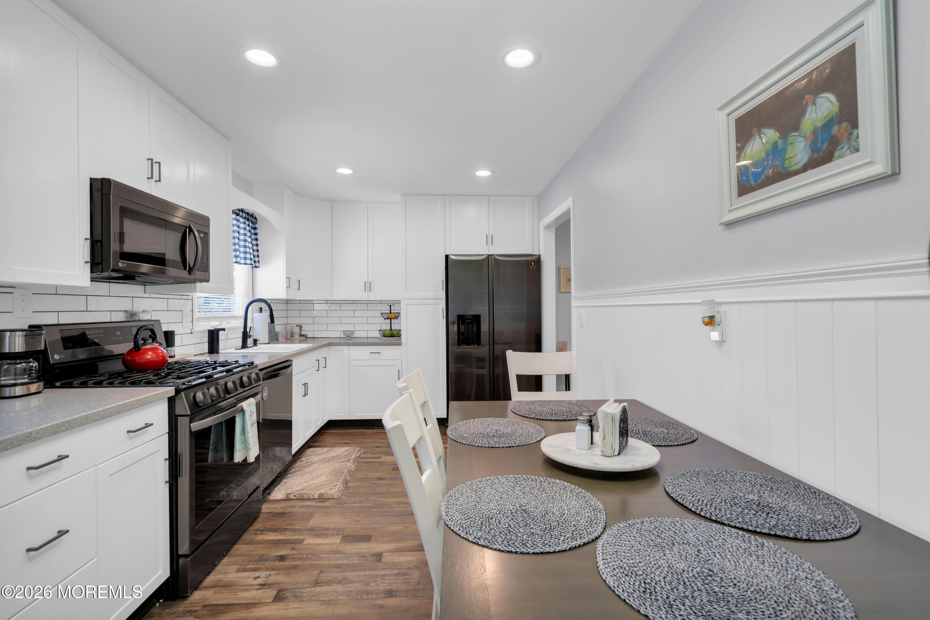 1335 Sunrise Avenue Point Pleasant, NJ 08742 - Photo 26 of 51 a kitchen with stainless steel appliances kitchen island granite countertop a sink and cabinets