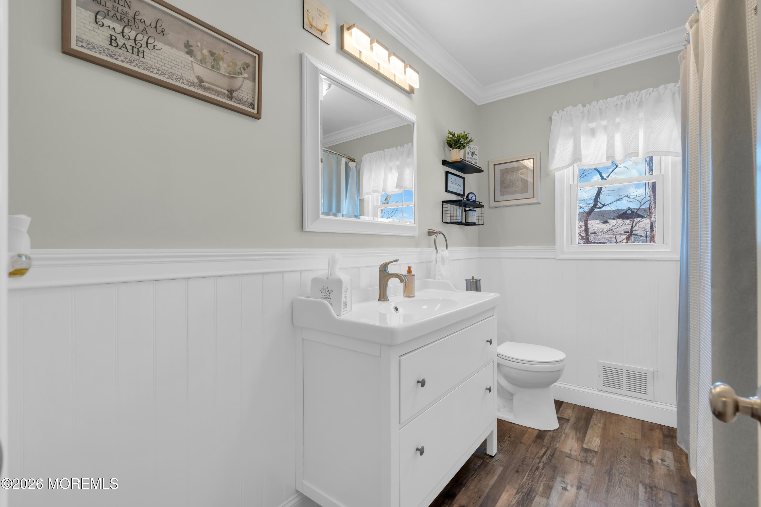 1335 Sunrise Avenue Point Pleasant, NJ 08742 - Photo 35 of 51 a view of bathroom with a sink toilet and a mirror