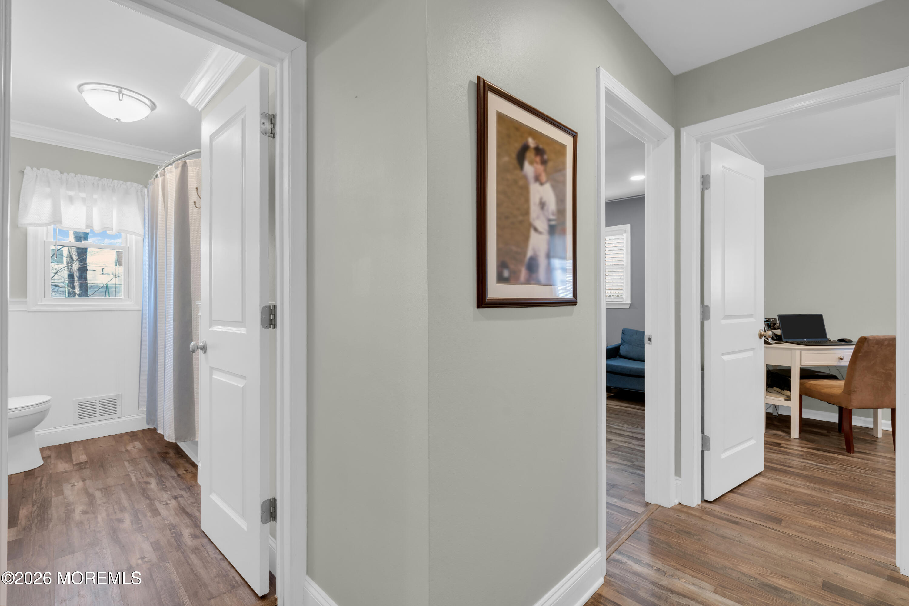 1335 Sunrise Avenue Point Pleasant, NJ 08742 - Photo 37 of 51 a view of a hallway with wooden floor and dining room