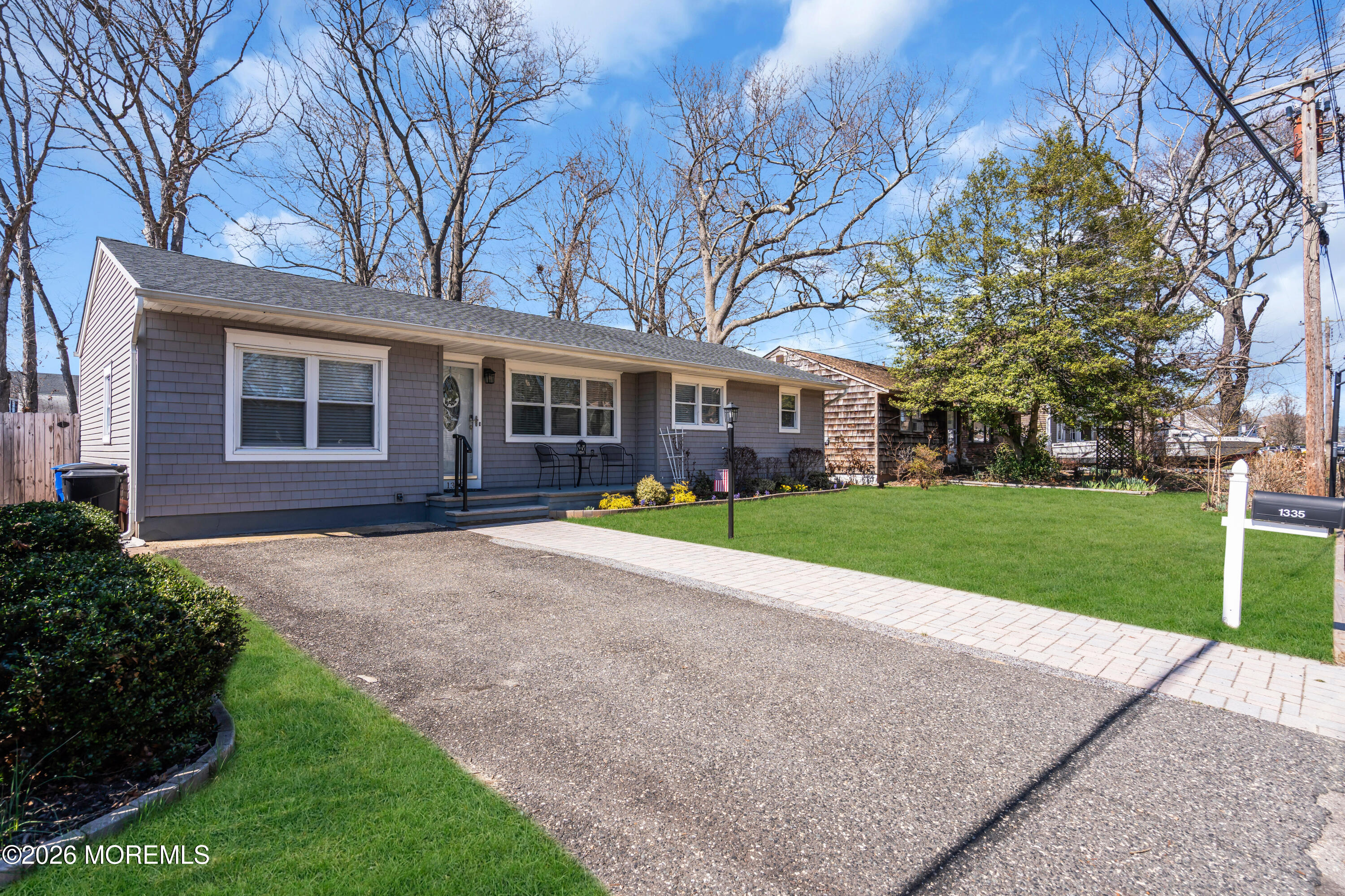 1335 Sunrise Avenue Point Pleasant, NJ 08742 - Photo 7 of 51 a view of a house with a big yard and large trees
