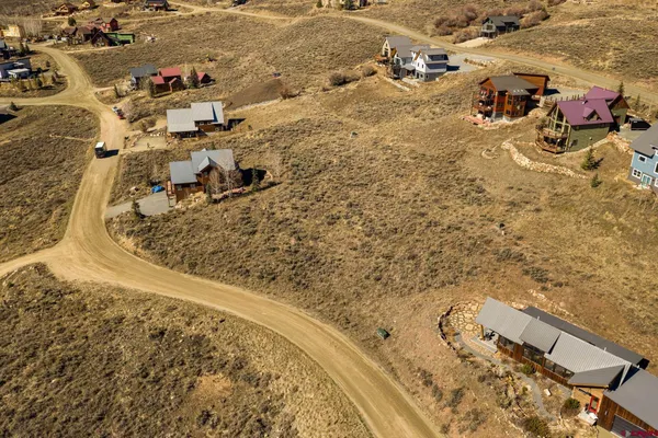 an aerial view of residential houses with outdoor space