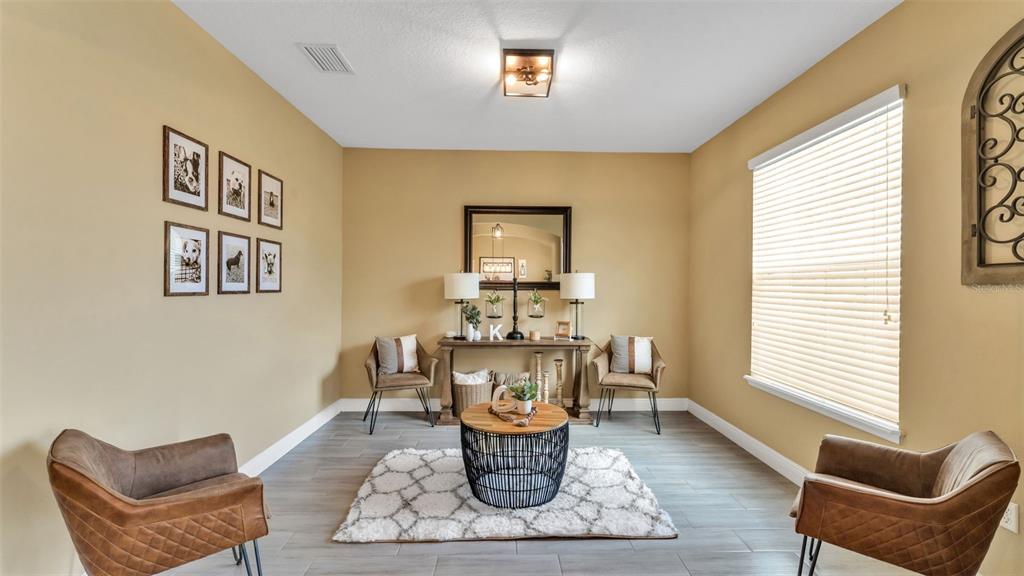 4105 Berkshire Loop Lakeland, FL 33813 - Photo 11 of 41 a living room with furniture and a large window