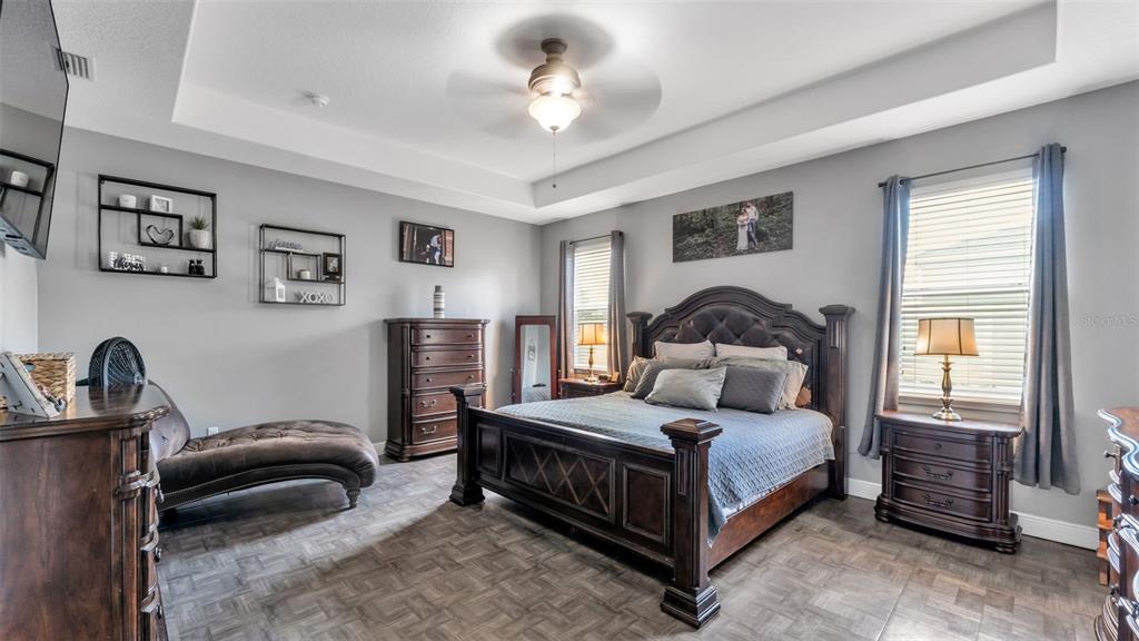 4105 Berkshire Loop Lakeland, FL 33813 - Photo 22 of 41 a bedroom with a bed and a dresser