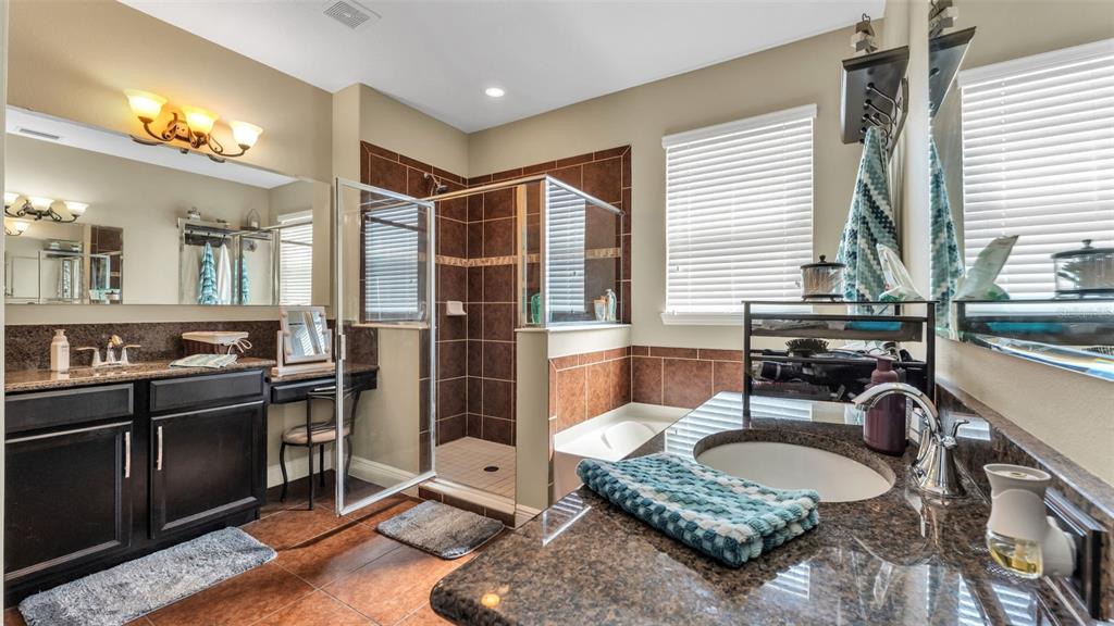 4105 Berkshire Loop Lakeland, FL 33813 - Photo 25 of 41 a dining room with a table chairs and a kitchen view