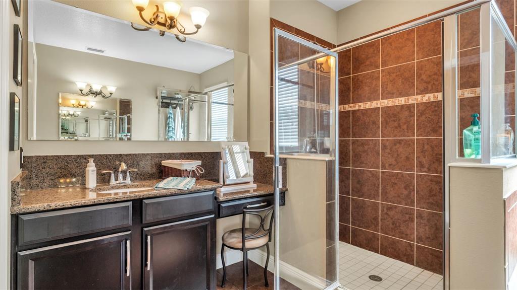 4105 Berkshire Loop Lakeland, FL 33813 - Photo 27 of 41 a bathroom with a sink and a mirror