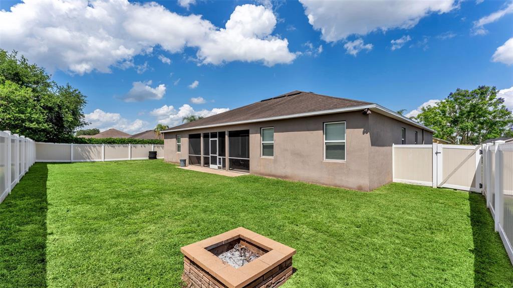 4105 Berkshire Loop Lakeland, FL 33813 - Photo 36 of 41 a view of a house with backyard and garden