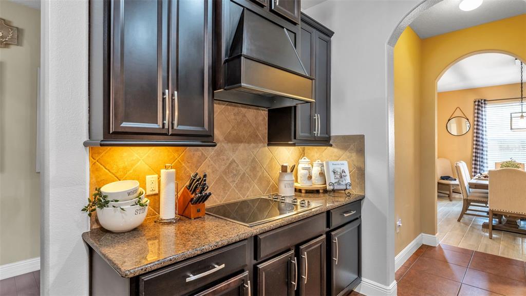 4105 Berkshire Loop Lakeland, FL 33813 - Photo 4 of 41 a kitchen with stainless steel appliances granite countertop a sink and a refrigerator