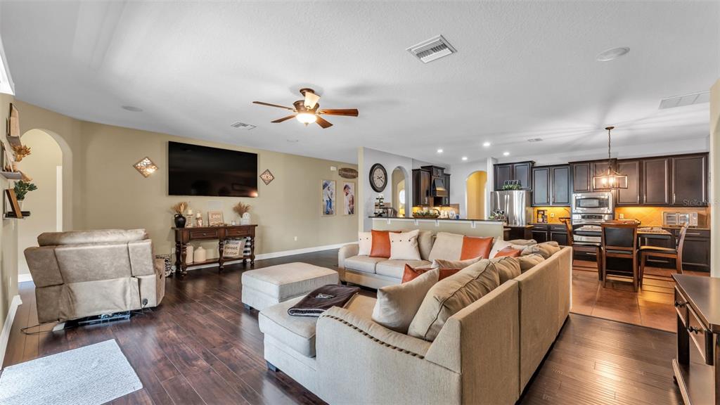 4105 Berkshire Loop Lakeland, FL 33813 - Photo 7 of 41 a living room with furniture and a flat screen tv