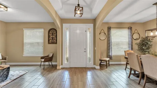 a view of a livingroom with furniture and windows