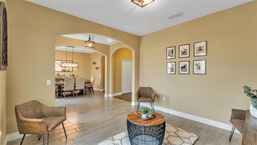 4105 Berkshire Loop Lakeland, FL 33813 - Photo 10 of 41 a living room with furniture and wooden floor