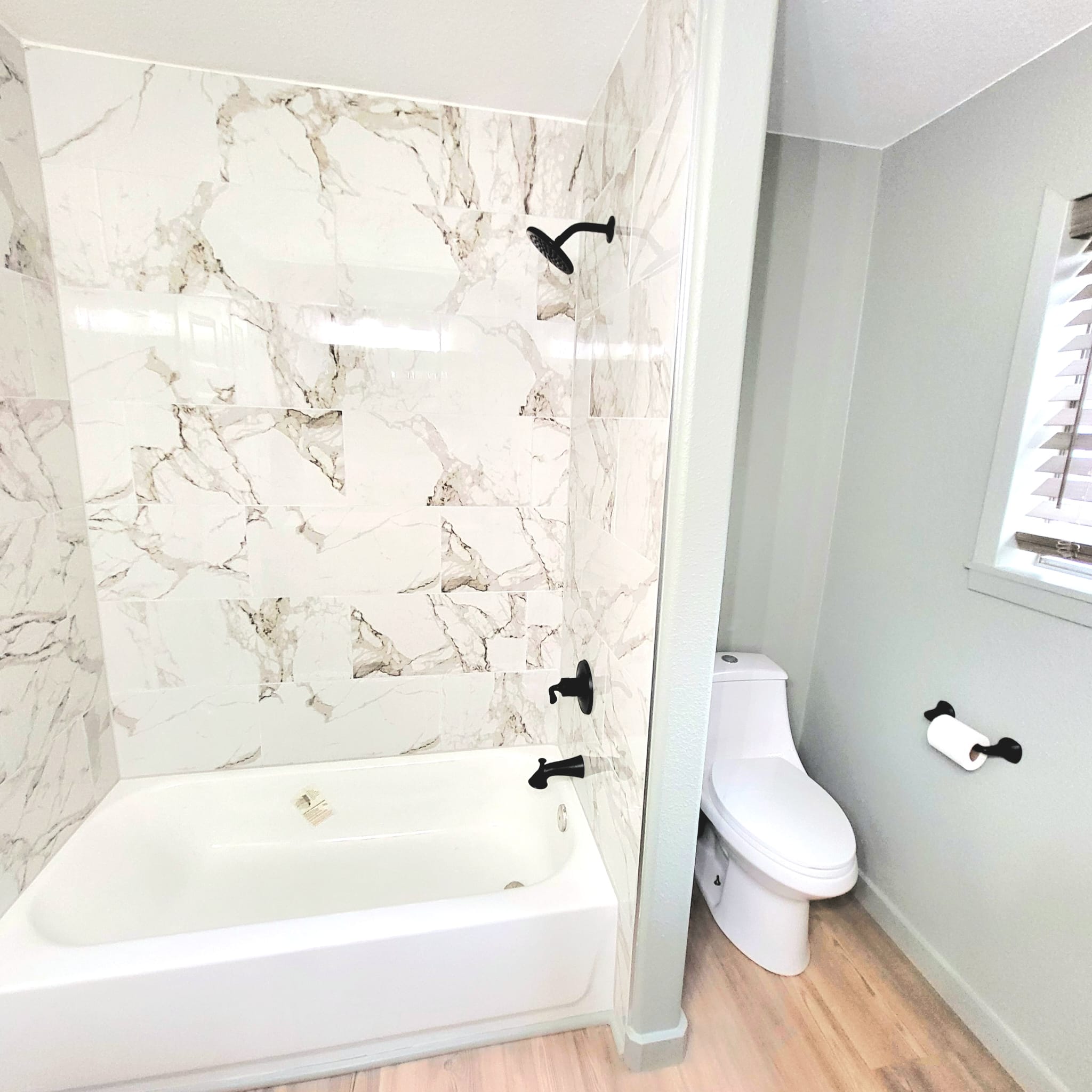 1608 Longhofer Street Brenham, TX 77833 - Photo 16 of 24 a bathroom with a bathtub and toilet