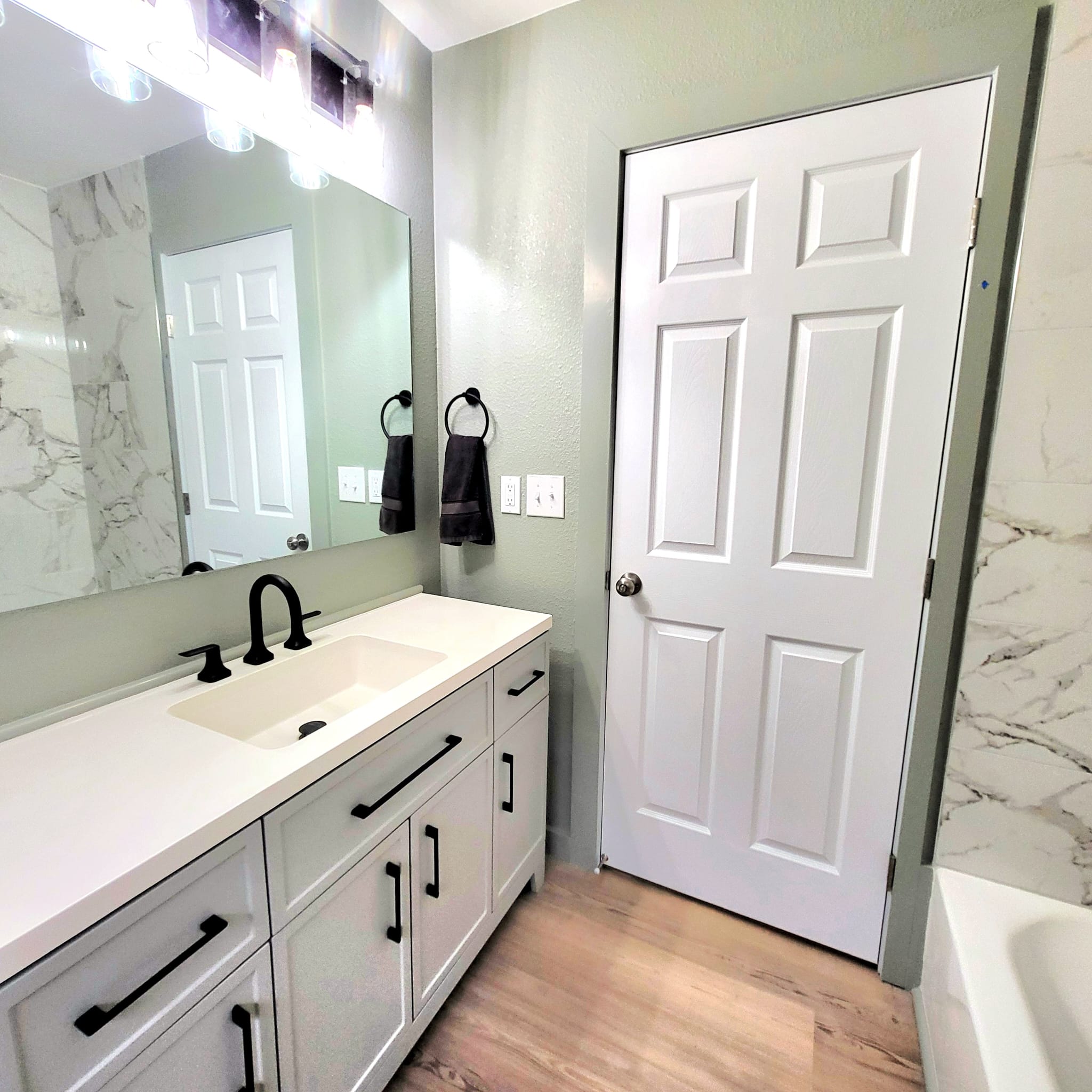 1608 Longhofer Street Brenham, TX 77833 - Photo 17 of 24 a bathroom with a double vanity sink and a mirror