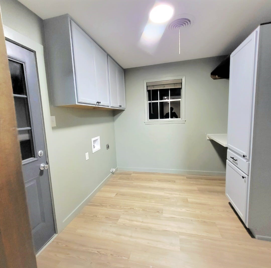 1608 Longhofer Street Brenham, TX 77833 - Photo 22 of 24 a view of an empty room with a kitchen