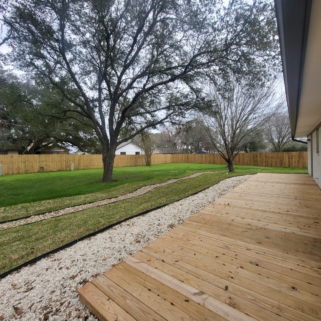 1608 Longhofer Street Brenham, TX 77833 - Photo 3 of 24 a view of a park with large trees