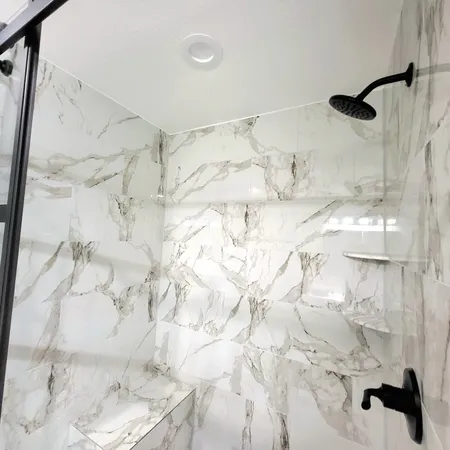 a bathroom with a sink and shower