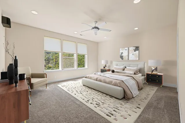 a kitchen with stainless steel appliances kitchen island granite countertop a table chairs and a refrigerator