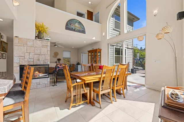 a spacious bedroom with a bed a dresser and a window
