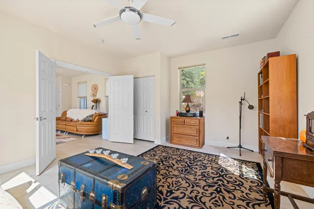 a en suite bathroom with a sink double vanity and a mirror
