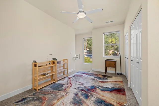 a spacious bathroom with a granite countertop sink and a mirror