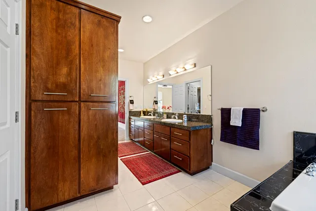 a view of a chairs and table on the balcony