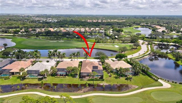 an aerial view of residential houses with outdoor space and swimming pool