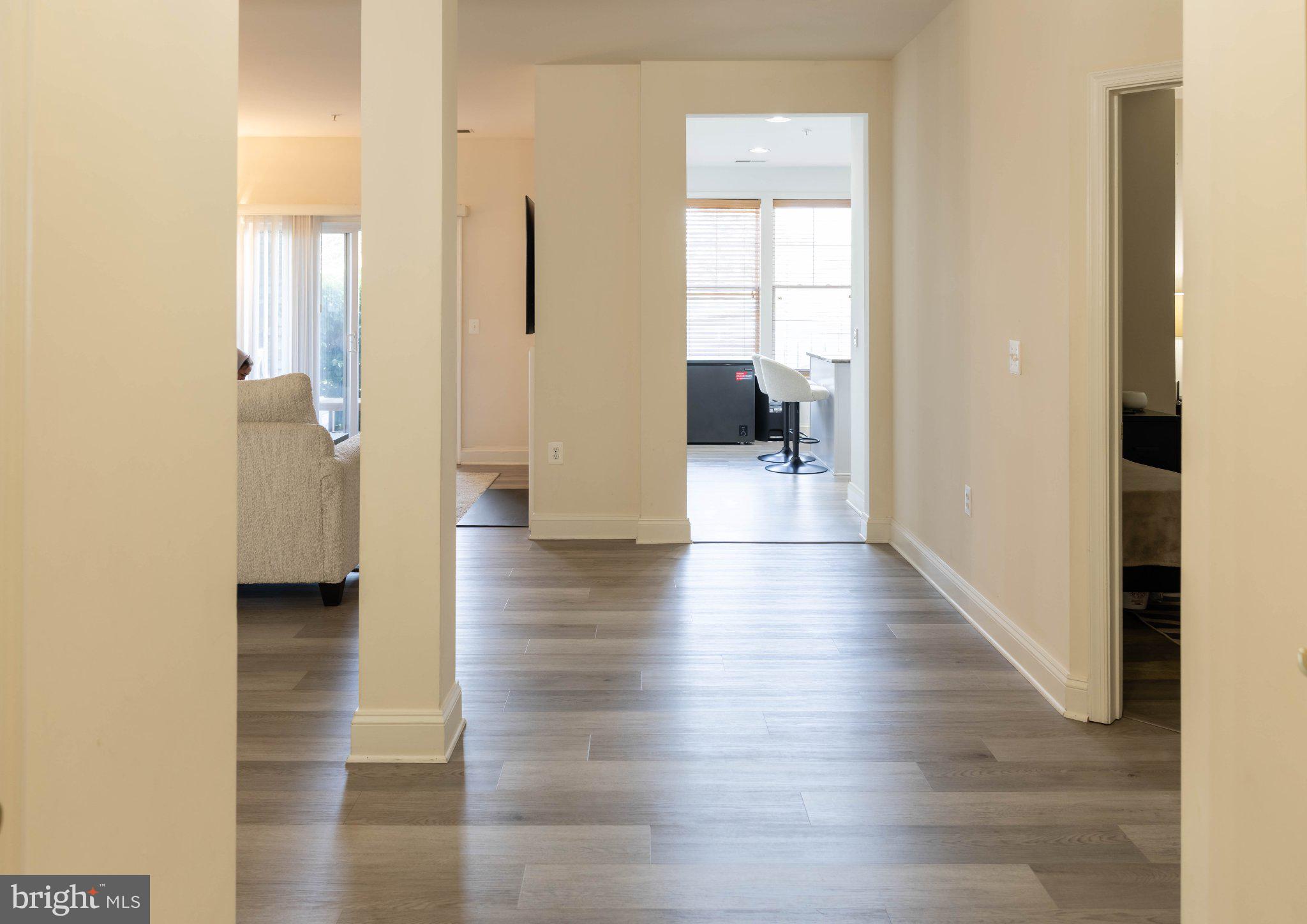 12824 Clarksburg Square Road, Unit 105 Clarksburg, MD 20871 - Photo 60 of 96 Spacious hallway with natural light.
