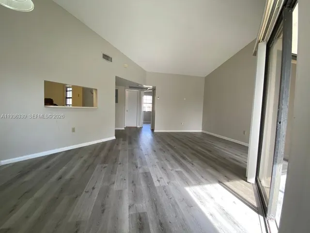 a kitchen with a sink a refrigerator a stove and cabinets