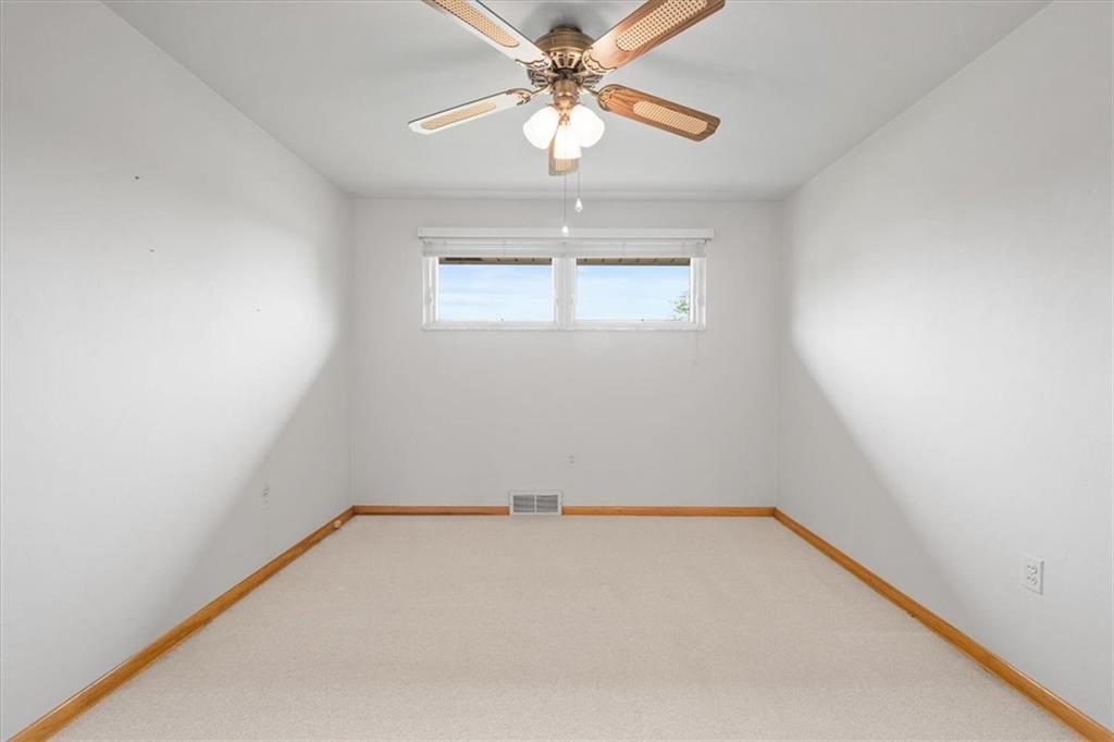 1020 Silver Lane McKees Rocks, PA 15136 - Photo 11 of 36 an empty room with a window and a fan