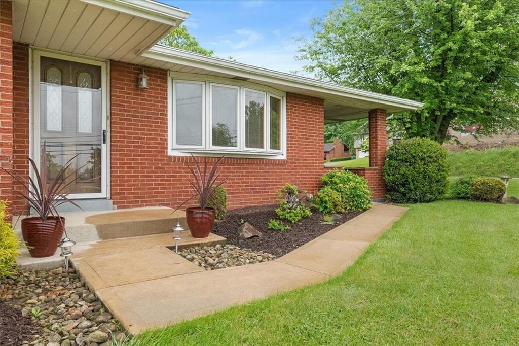 1020 Silver Lane McKees Rocks, PA 15136 - Photo 2 of 36 a front view of a house with garden