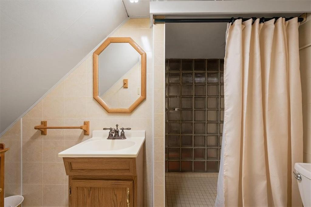 1020 Silver Lane McKees Rocks, PA 15136 - Photo 21 of 36 a bathroom with a sink and a mirror