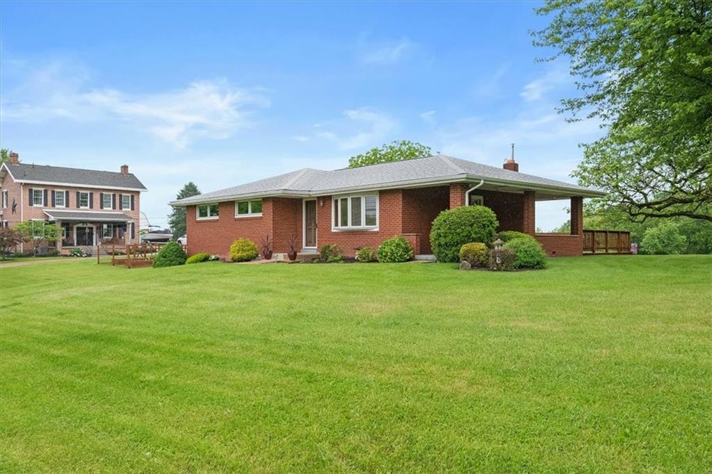 1020 Silver Lane McKees Rocks, PA 15136 - Photo 33 of 36 a front view of a house with garden