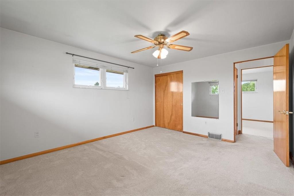 1020 Silver Lane McKees Rocks, PA 15136 - Photo 6 of 36 an empty room with windows and fan