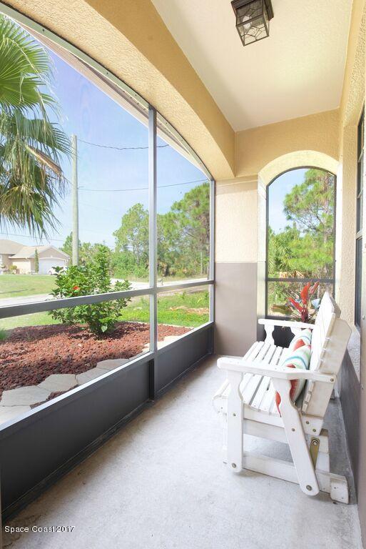249 Franzing Street Palm Bay, FL 32908 - Photo 2 of 20 a room with a large window and a bed