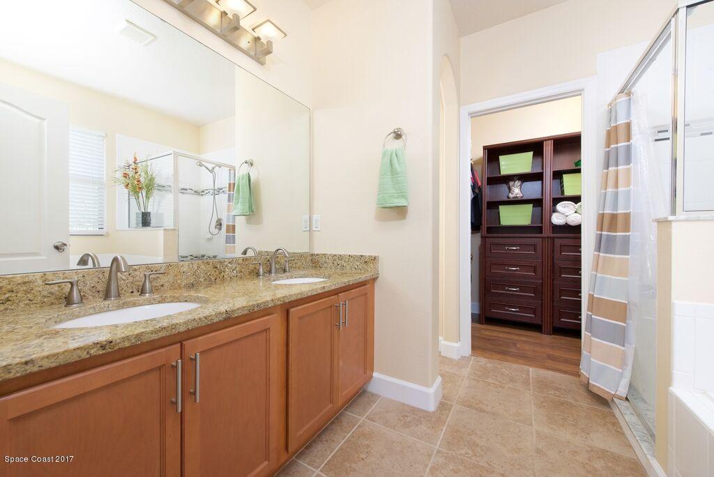 249 Franzing Street Palm Bay, FL 32908 - Photo 10 of 20 a bathroom with a granite countertop sink and a mirror