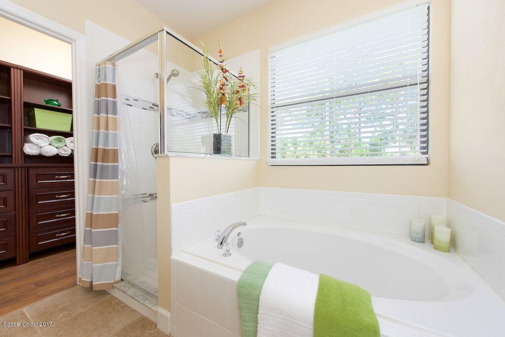 249 Franzing Street Palm Bay, FL 32908 - Photo 11 of 20 a bathroom with a bathtub and a shower