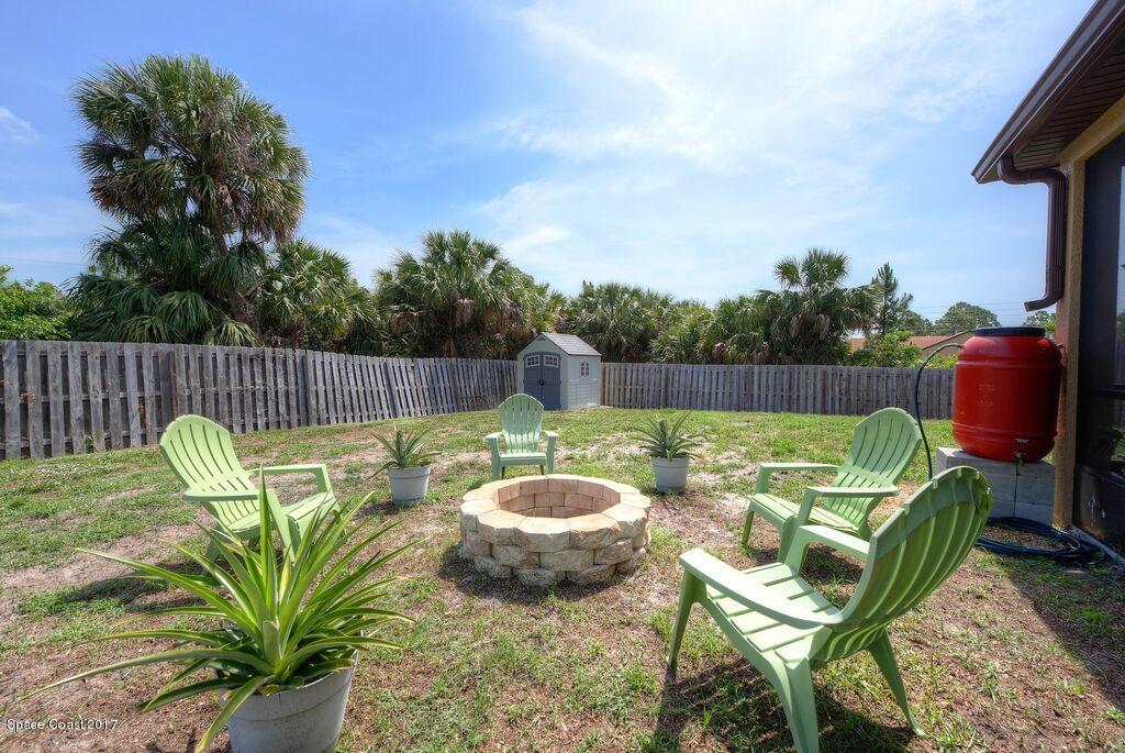 249 Franzing Street Palm Bay, FL 32908 - Photo 16 of 20 a view of a backyard with swimming pool and furniture