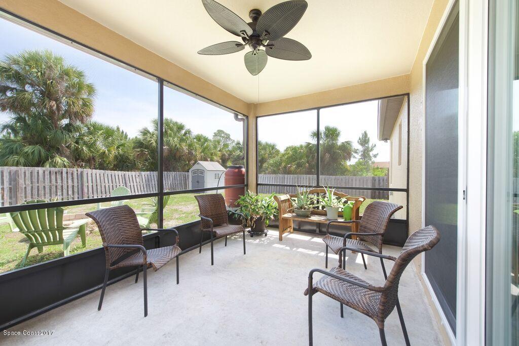 249 Franzing Street Palm Bay, FL 32908 - Photo 17 of 20 a living room with furniture and a floor to ceiling window