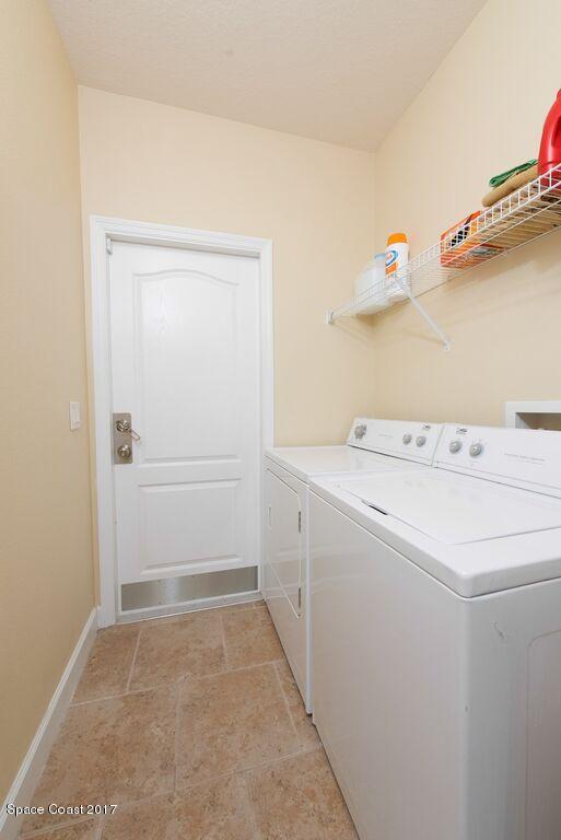 249 Franzing Street Palm Bay, FL 32908 - Photo 18 of 20 a utility room with dryer and washer