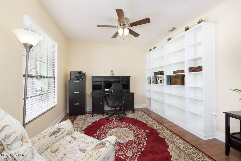 249 Franzing Street Palm Bay, FL 32908 - Photo 5 of 20 a bedroom with a bed and a window