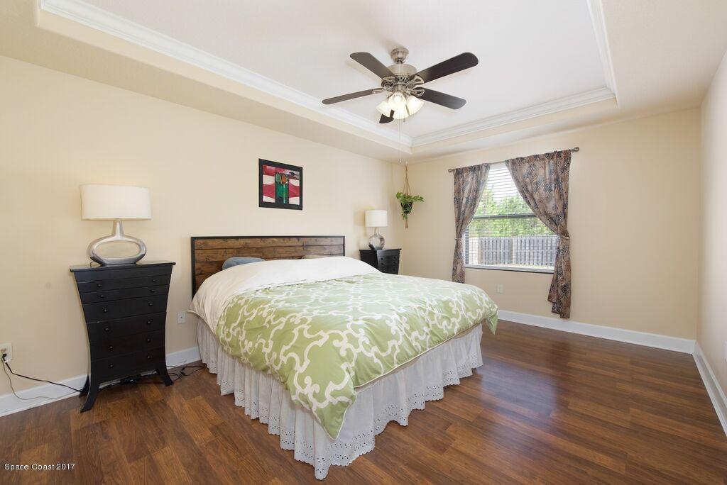 249 Franzing Street Palm Bay, FL 32908 - Photo 9 of 20 a bedroom with a bed and a window
