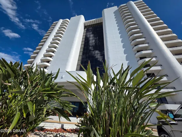 a view of a tall white building