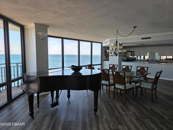 a view of a dining room with furniture window and wooden floor