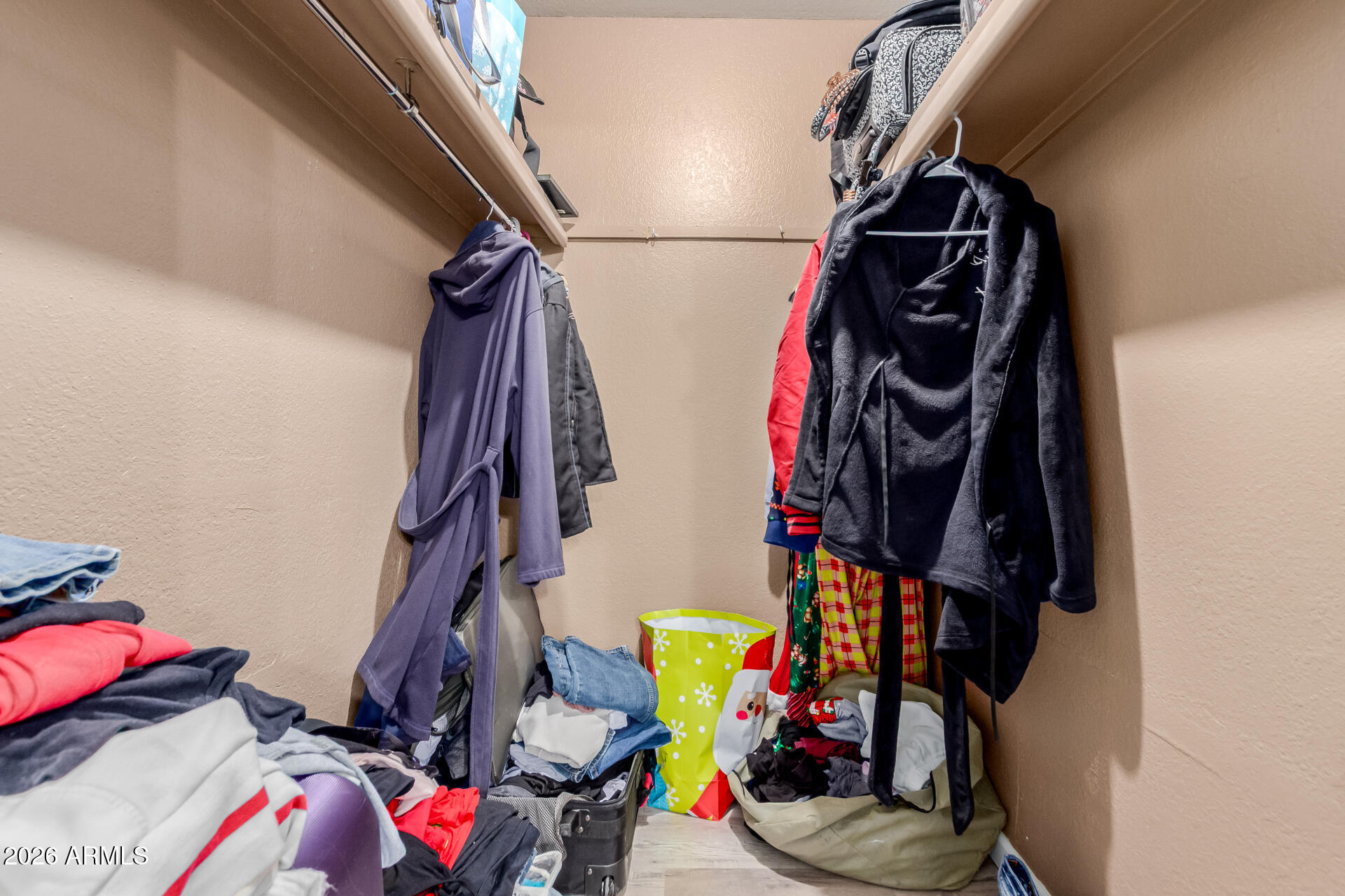 9403 East Cisco Road Mesa, AZ 85207 - Photo 12 of 20 a view of walk in closet with clothes and shoes