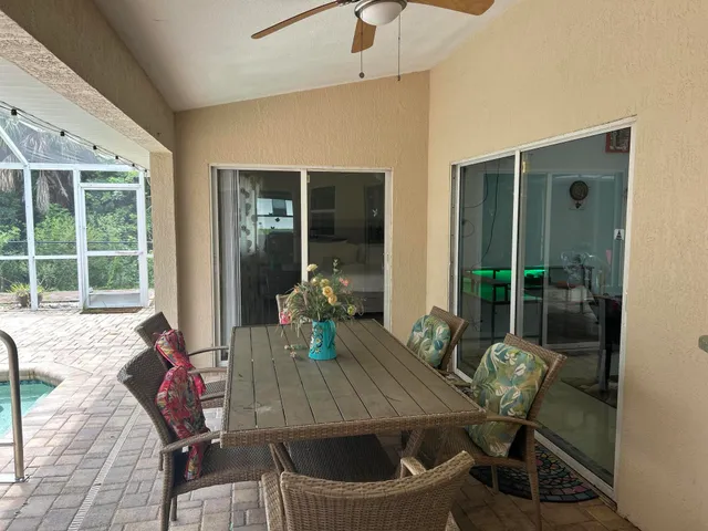 a view of a roof deck with chair and table