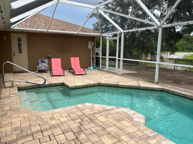 a house view with a backyard space