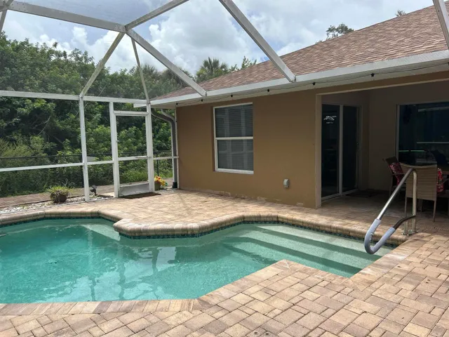 a view of outdoor space with deck and trees